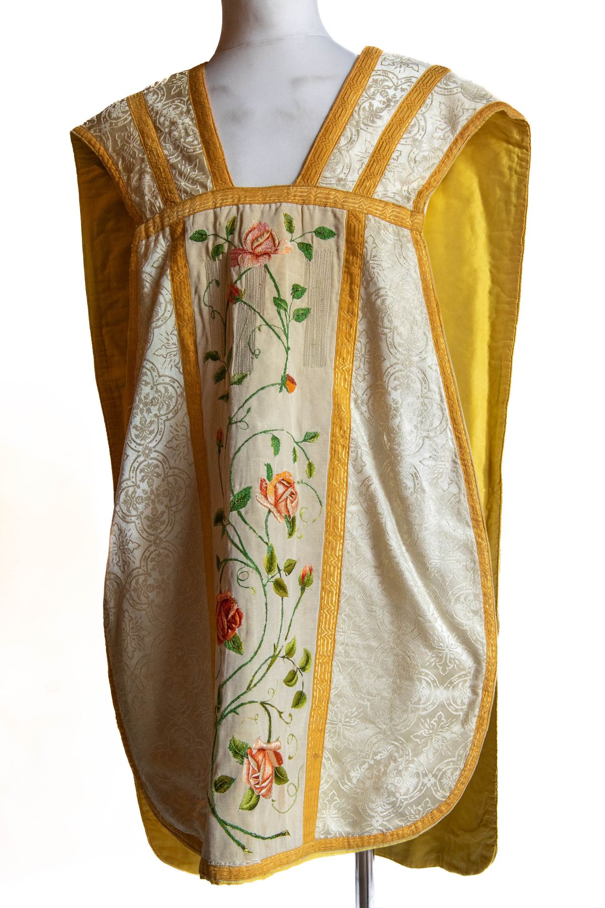 White chasuble with Marian emblem and cones